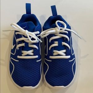 New. Blue Nikes, white laces, sole, and symbol.